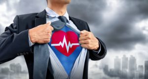medical professional in superhero costume with heartbeat
